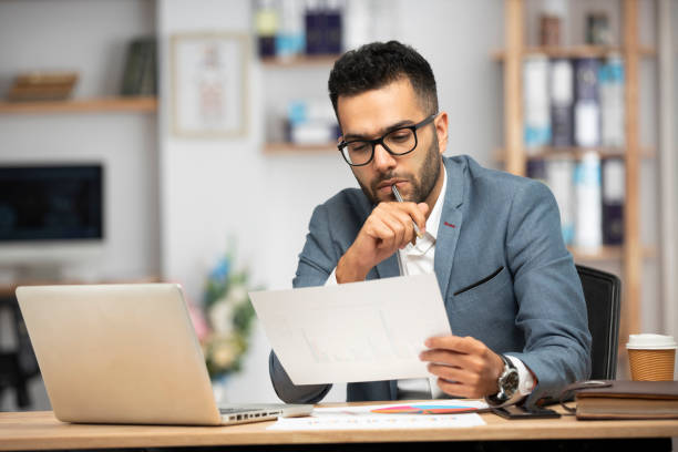 Portrait of a handsome young businessman working in an office